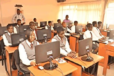 Nigerian students confidently taking CBT exams on computers